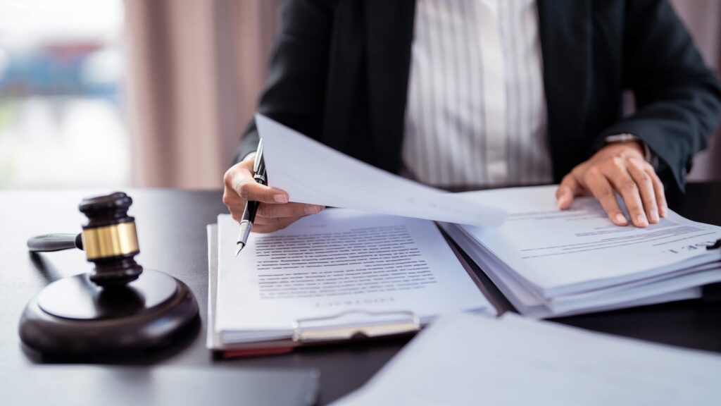 Lawyer holding a document to read a lawsuit