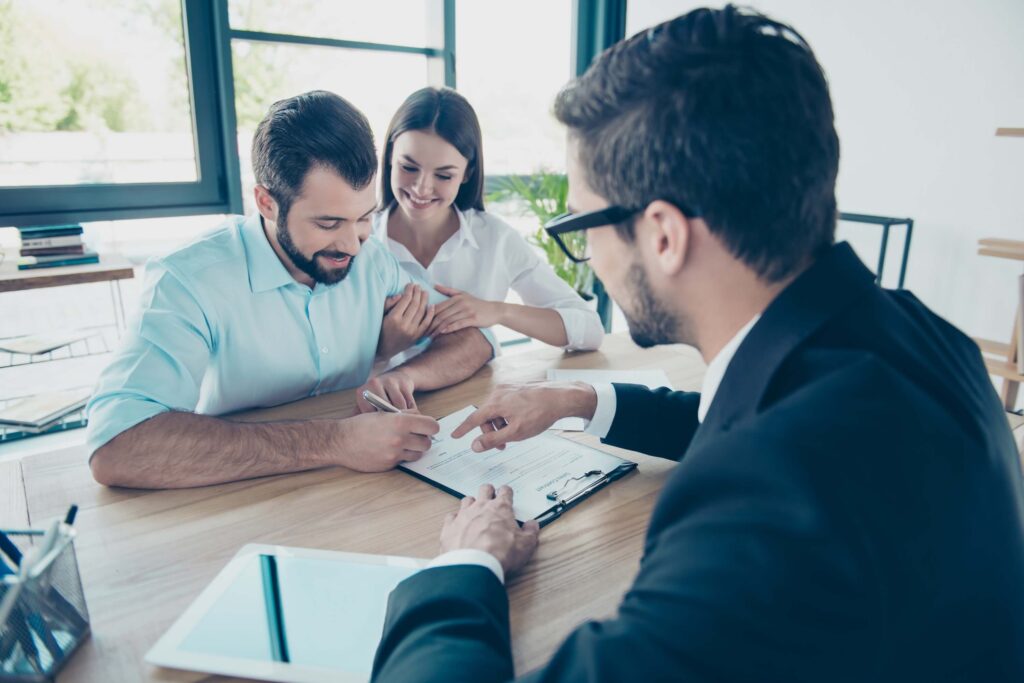 A happy couple is buying a new home image