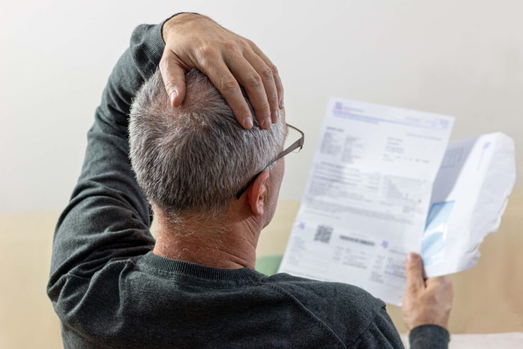 man reading unexpected news on a paper document