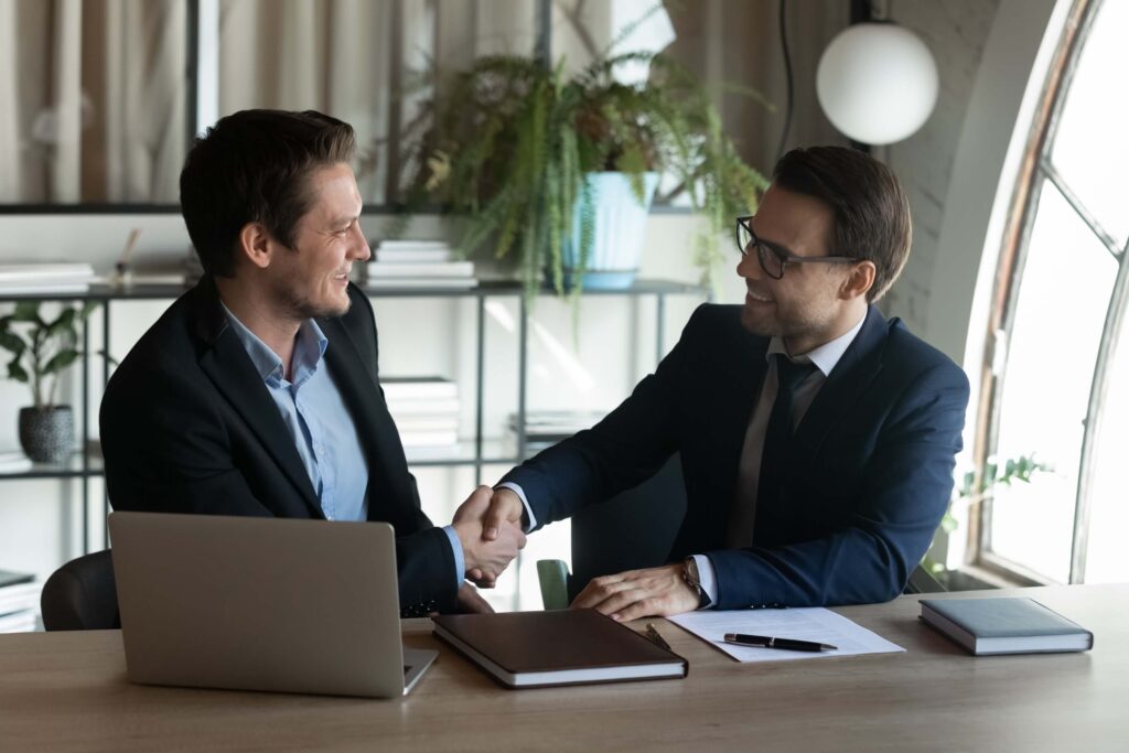 Shake hands after reaching a successful deal