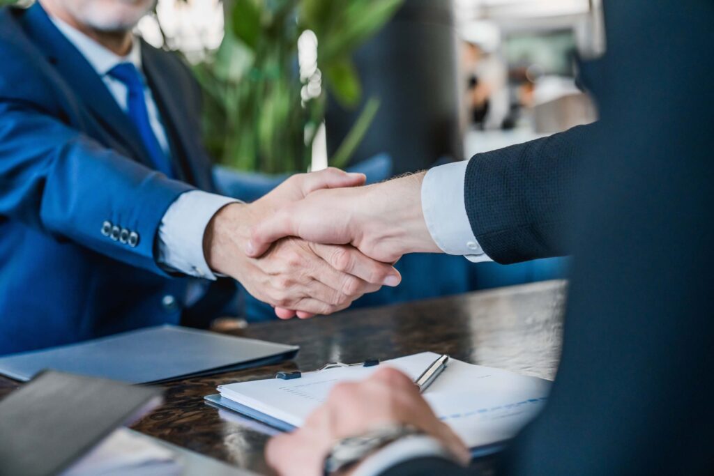 Hands shaking after reaching an agreement at a meeting